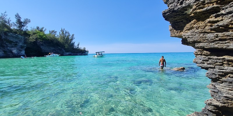 Man wading in the turquoise waters in Bermuda