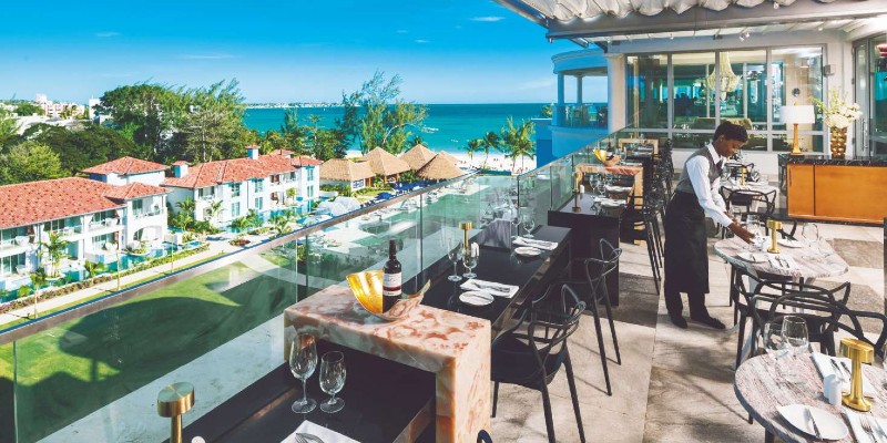 A French restaurant at Sandals Royal Barbados overlooking the bay