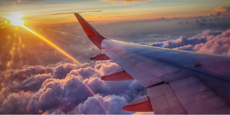 A plane flying above the clouds