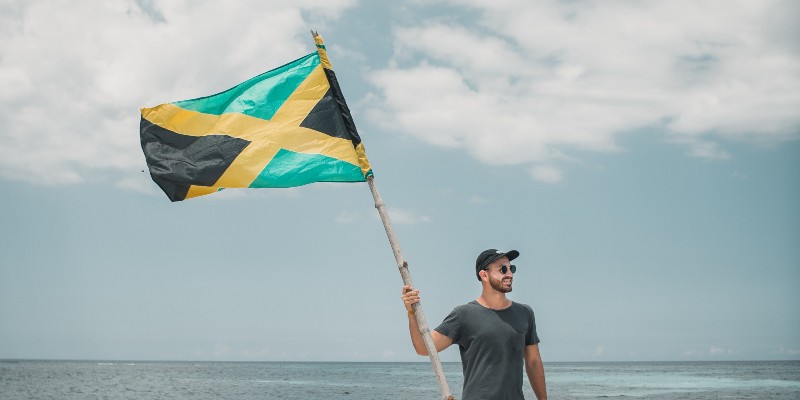 Man waving the Jamaica flag