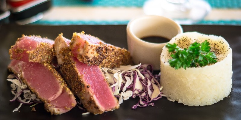 pistachio crusted tuna with lime mashed potato and soy reduction