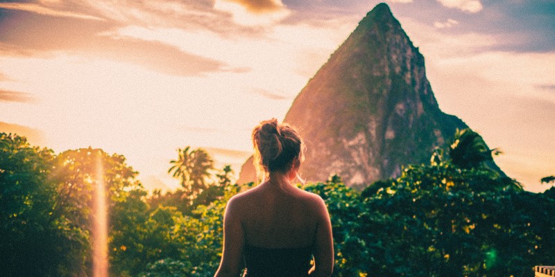 Woman exploring St Lucia with the Pitons in the background
