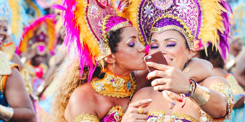 Two women celebrate Carnival in the Caribbean