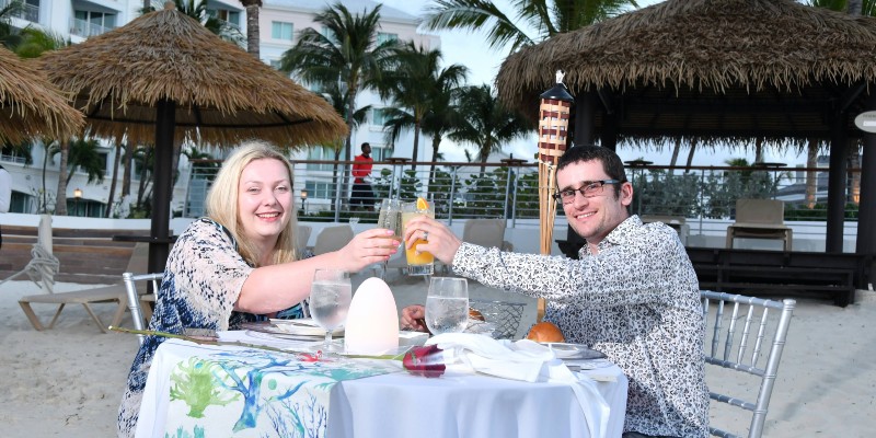 Phil and Beth enjoy dinner on the  beach