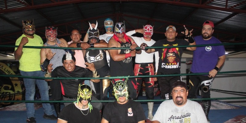 Lucha Libre performers posing for a picture in Cancun, Mexico