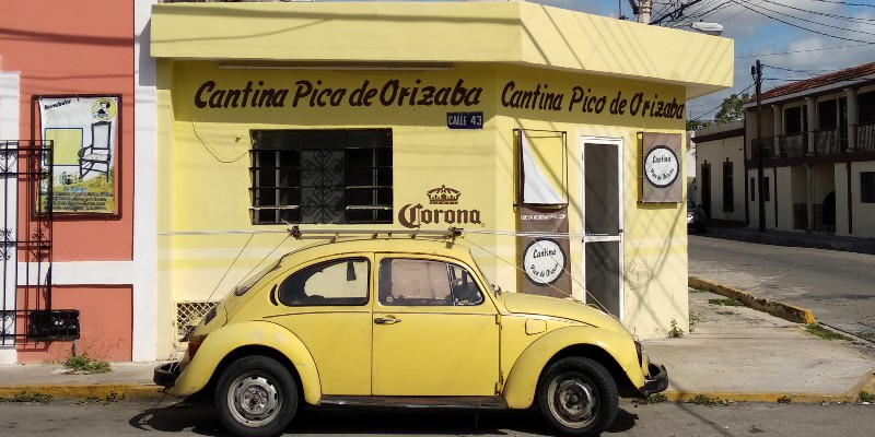 Yellow car outside a Mexican cantina