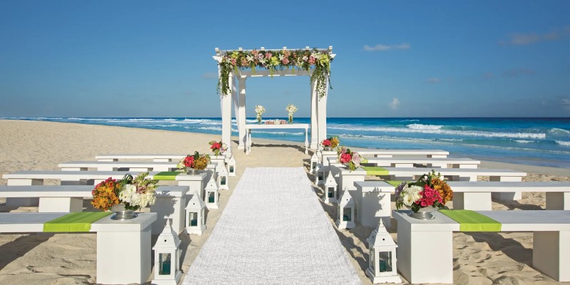 Wedding ceremony furniture laid out on the beach