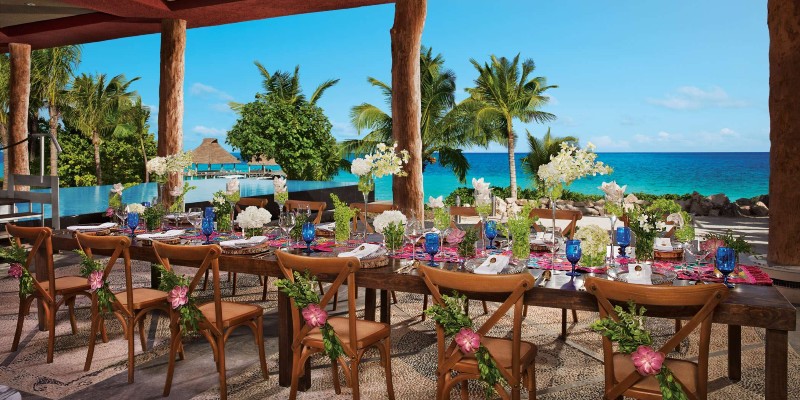 Dining table overlooking the Caribbean Sea set for wedding breakfast