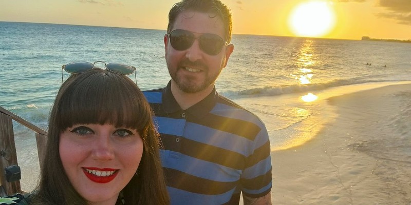 Couple taking a selfie at sunset on the beach in the Bahamas