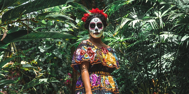 Woman with Cinco de Mayo facepaint in the jungle