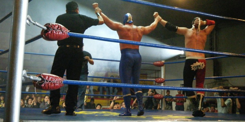 Mexican wrestlers celebrate for the crowd