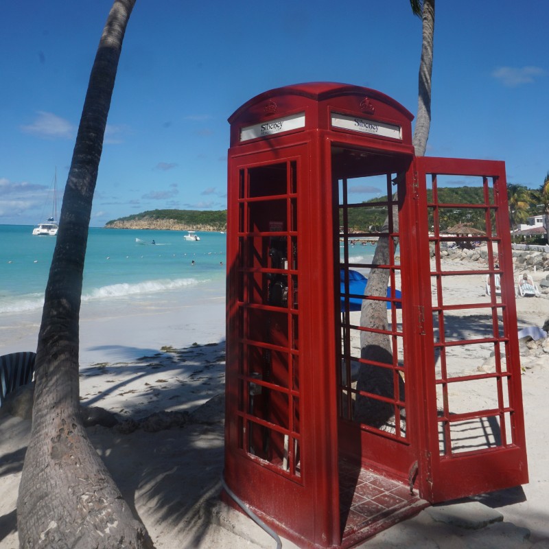 Red phonebox on Dickenson Bay.