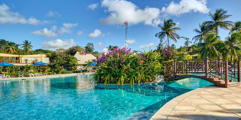 Relax poolside at Starfish Tobago Resort