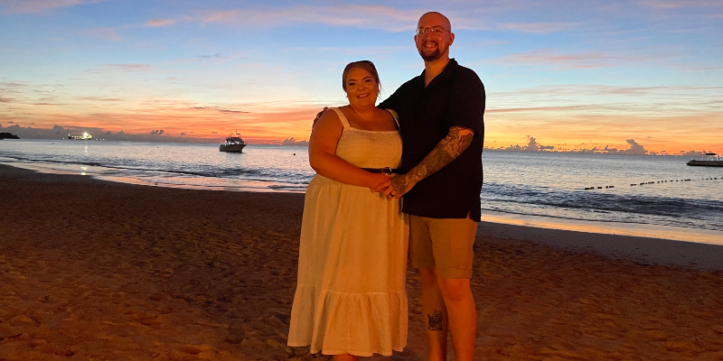 Celebrating after getting married at Sandals Antigua with a sunset meal on the beach. 