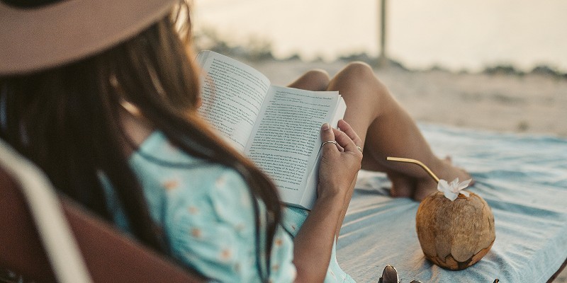 Woman reading a book on holiday
